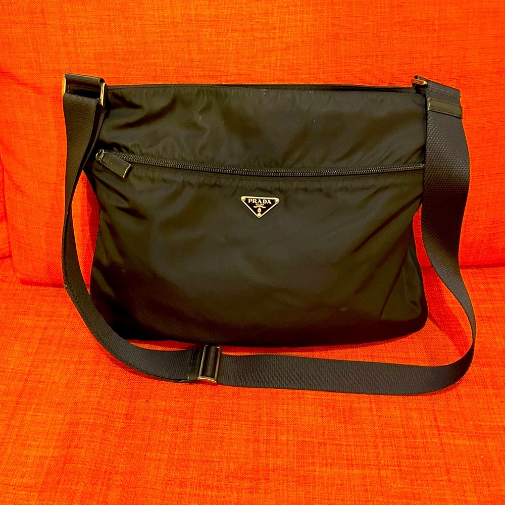 Black Prada Crossbody bag still good condition bag compartment inside have tear